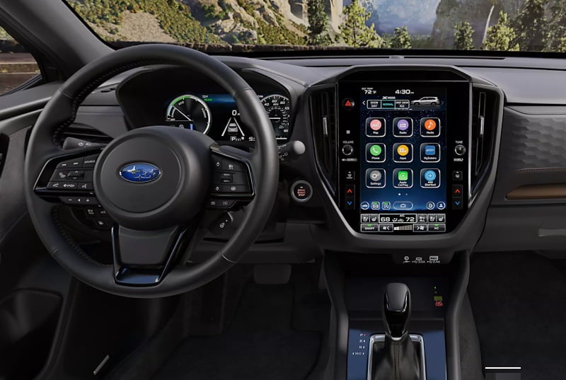 Subaru Forester Hybrid AWD SUV driver cockpit and 11.6-inch infotainment touchscreen.
